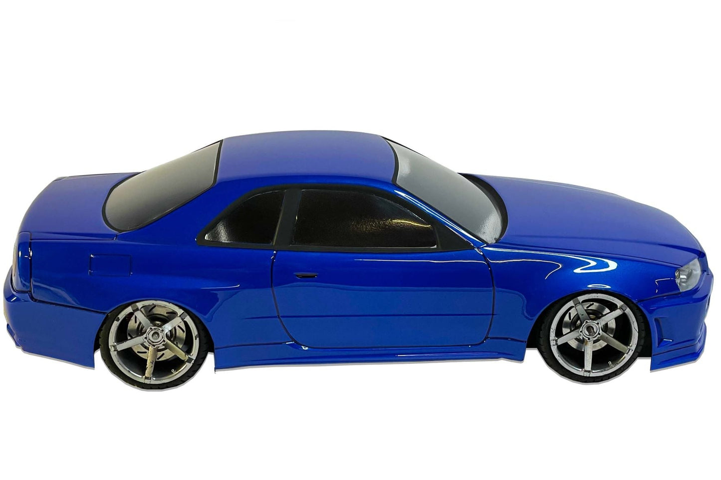 Nissan Skyline R34 Lexan RC body shell side profile showing legendary Japanese sports car proportions