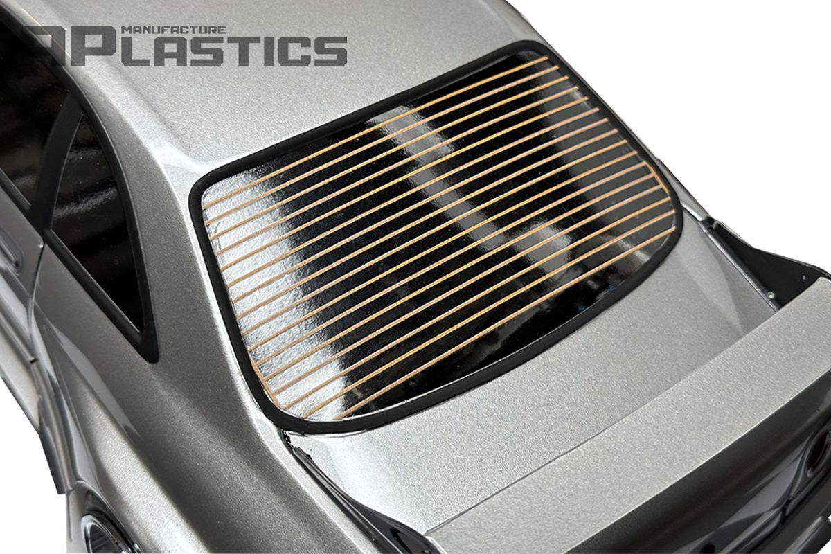 APlastics rear window defroster grid decal applied to a clear Lexan RC body shell showing the realistic heating line effect